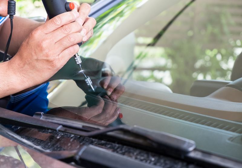 Resin injection under pressure: the 30-minute repair that stops a chip cold.